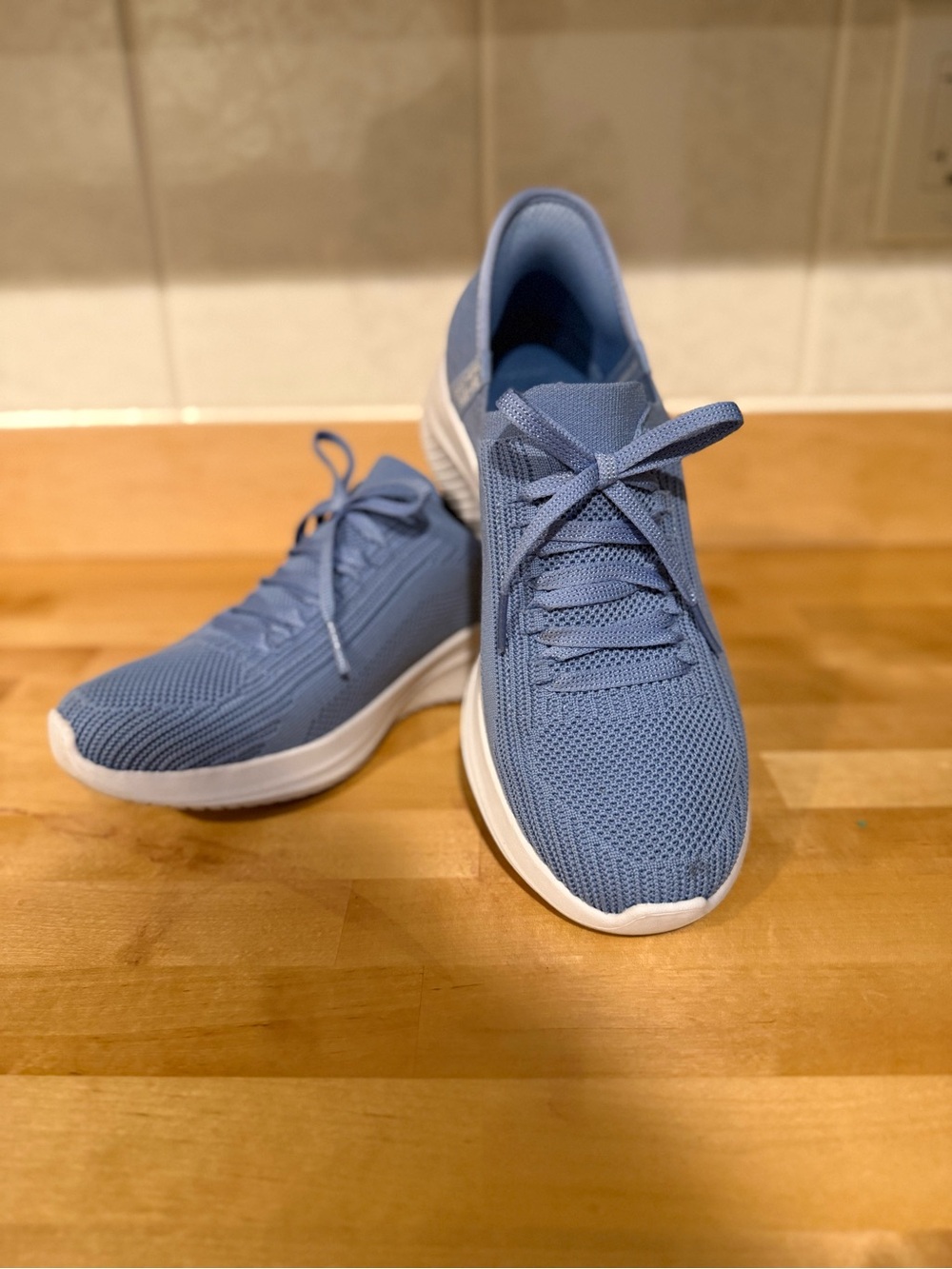 Skechers Women's Light Blue Knit Lace-Up Sneakers. Slip one
